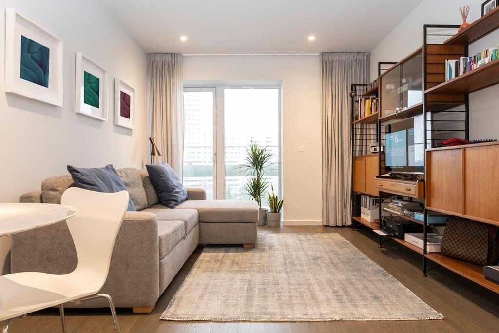 a living room with a couch and a tv at THE VIEW by condokeeper in London