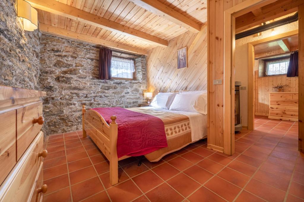 Posteľ alebo postele v izbe v ubytovaní Chalet indipendente Mas Tarlenta nel Parco Nazionale dello Stelvio