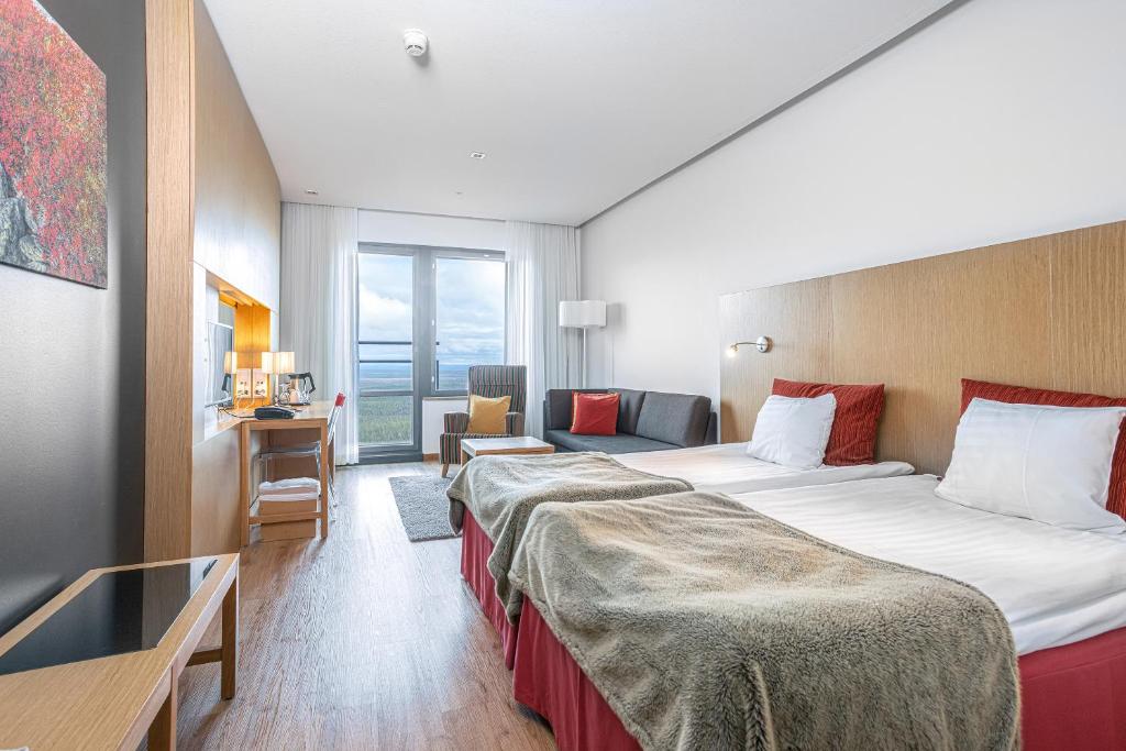 Postel nebo postele na pokoji v ubytování Hotel Levi Panorama