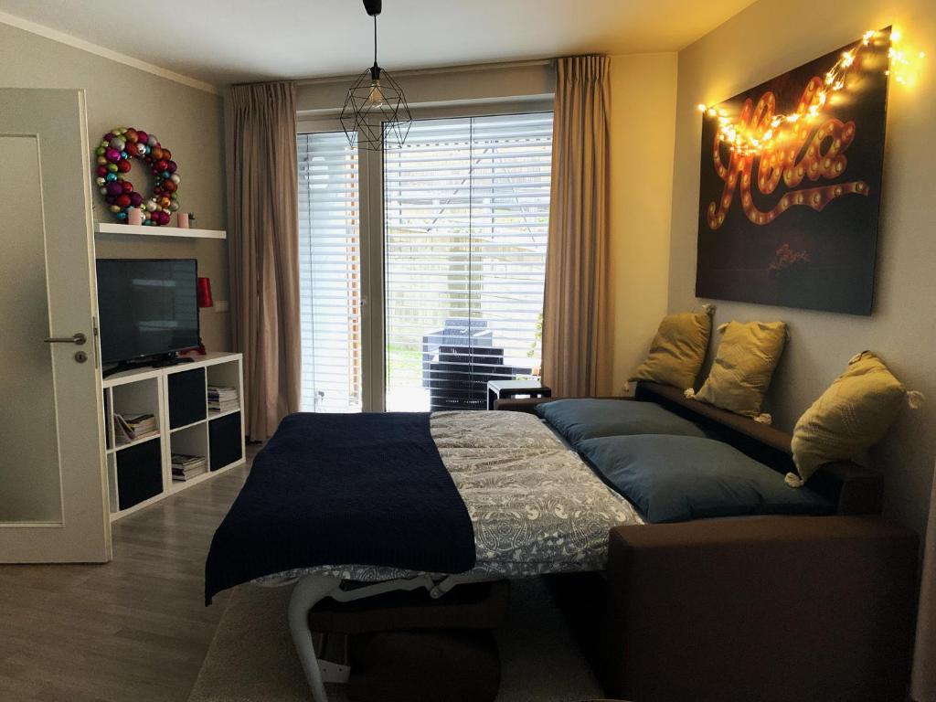 Posezení v ubytování Jezerní apartmán s terasou a saunou v Lakepark Residence