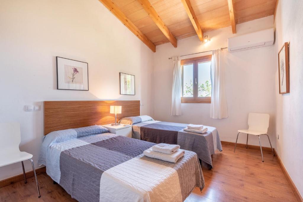 Postel nebo postele na pokoji v ubytování Finca Albocasser by Mallorca House Rent