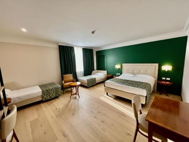 Postel nebo postele na pokoji v ubytování Relais La Fattoria