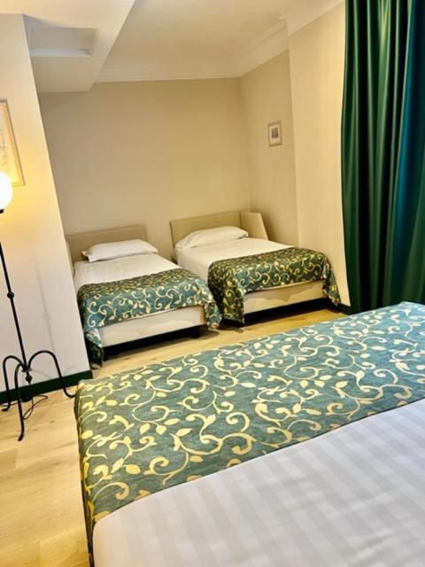 Postel nebo postele na pokoji v ubytování Relais La Fattoria