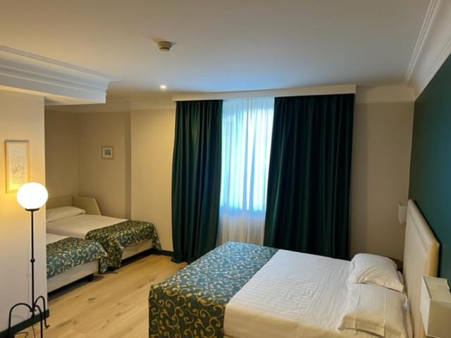 Postel nebo postele na pokoji v ubytování Relais La Fattoria