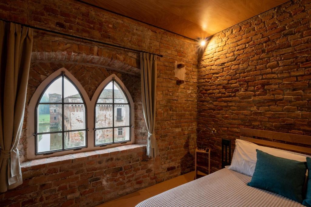 Postel nebo postele na pokoji v ubytování Agriturismo Padernello