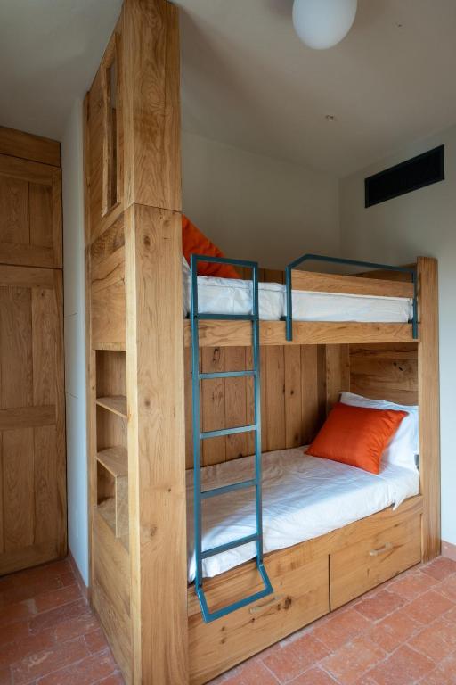 Postel nebo postele na pokoji v ubytování Agriturismo Padernello