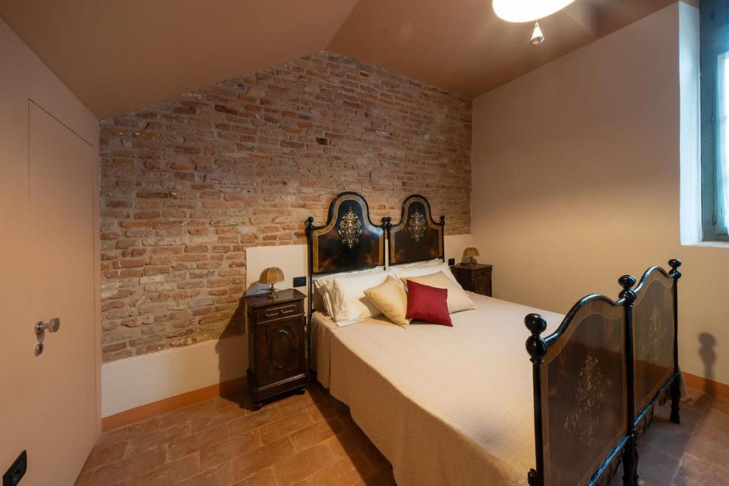 Postel nebo postele na pokoji v ubytování Agriturismo Padernello