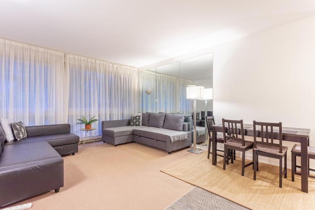 a living room with a couch and a table at Luxury Living in Saint Germain in Paris