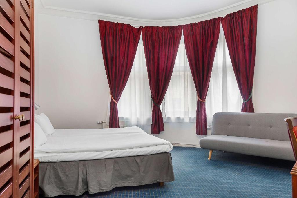 Postel nebo postele na pokoji v ubytování Best Western Tidbloms Hotel