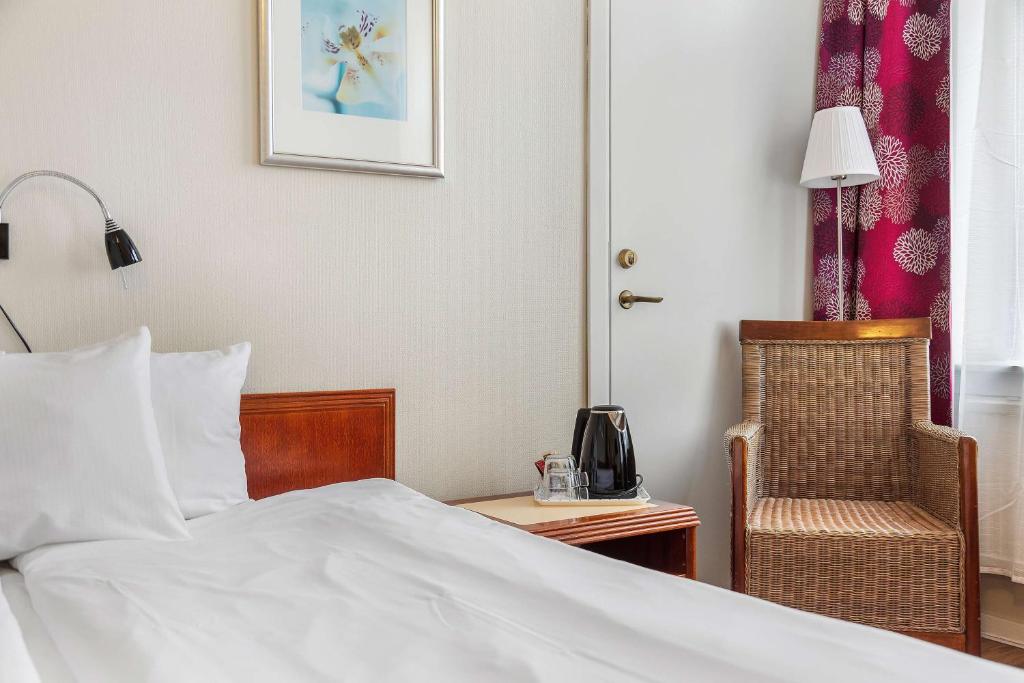 Postel nebo postele na pokoji v ubytování Best Western Tidbloms Hotel