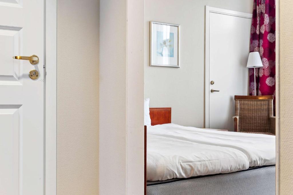 Postel nebo postele na pokoji v ubytování Best Western Tidbloms Hotel