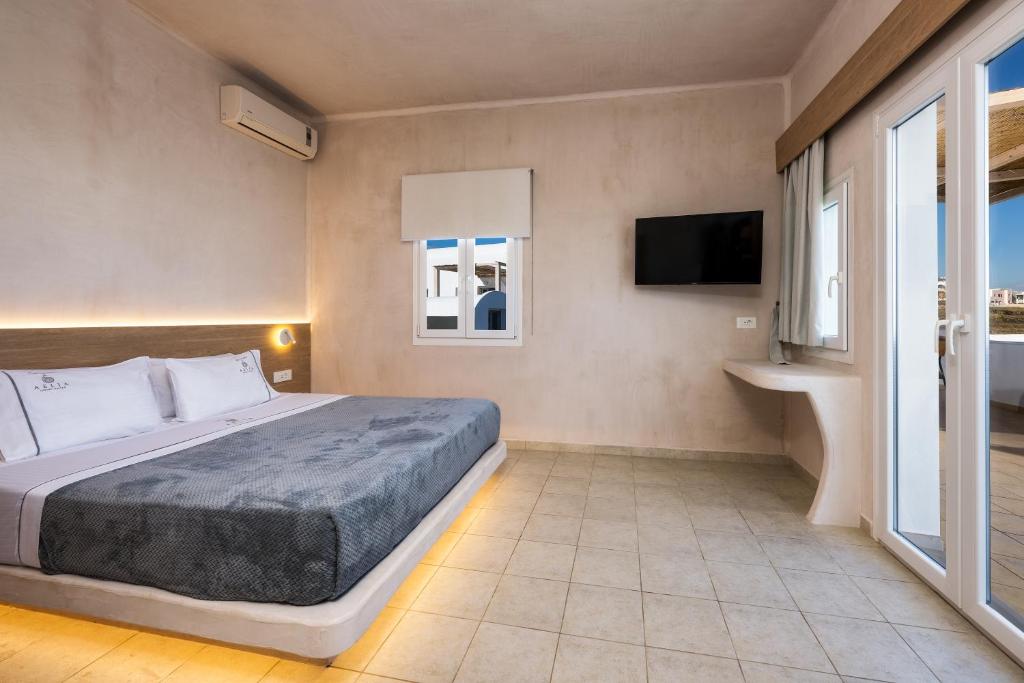 Postel nebo postele na pokoji v ubytování Aelia Luxury Suites