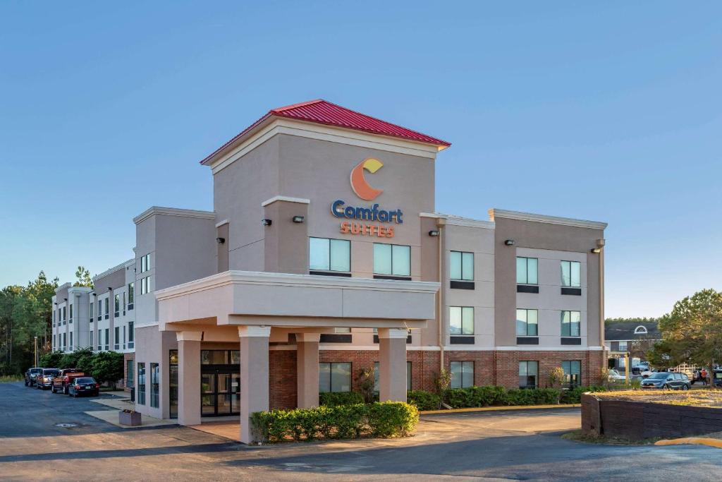 a building with a cambell services sign on it at Comfort Suites Natchitoches in Natchitoches