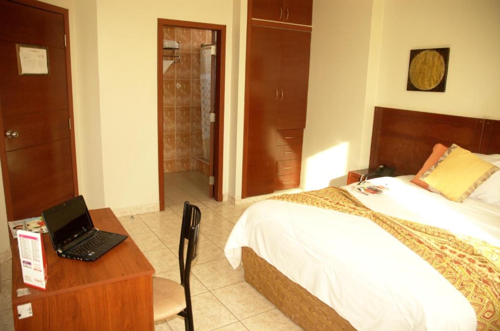 Postel nebo postele na pokoji v ubytování Hotel Air Suites