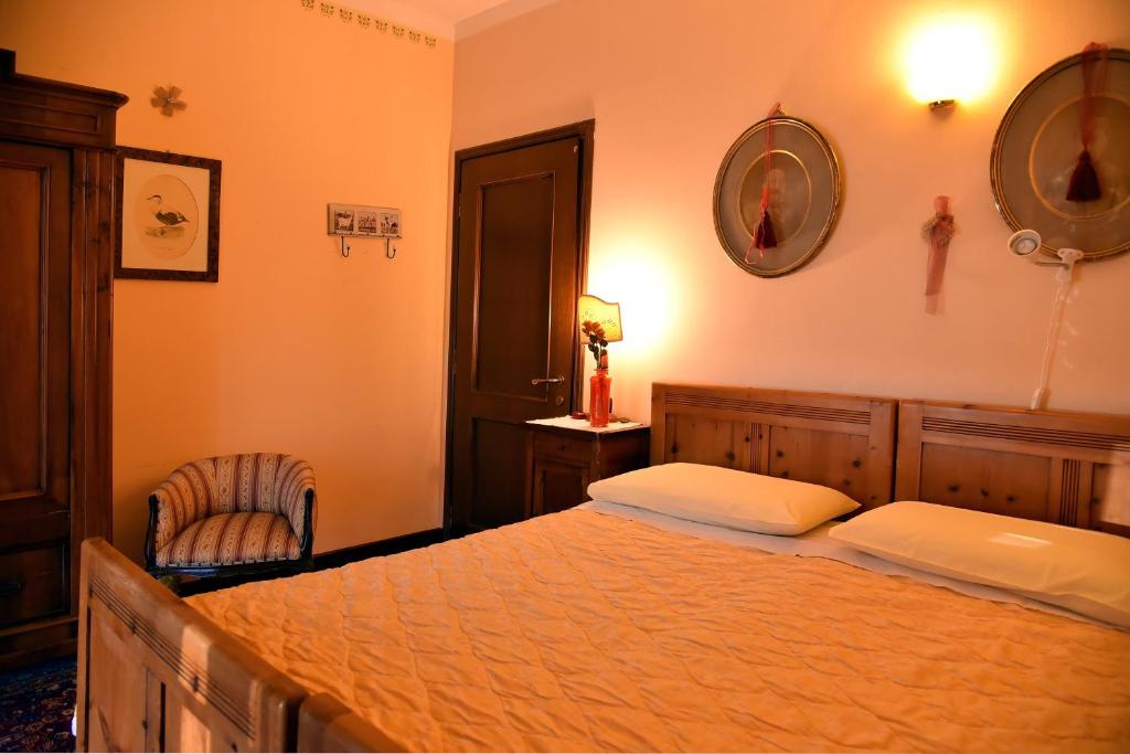 Un pat sau paturi într-o cameră la B&B Al Roncaccio