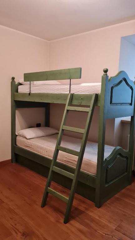 Posteľ alebo postele v izbe v ubytovaní Appartamento LO SCOIATTOLO