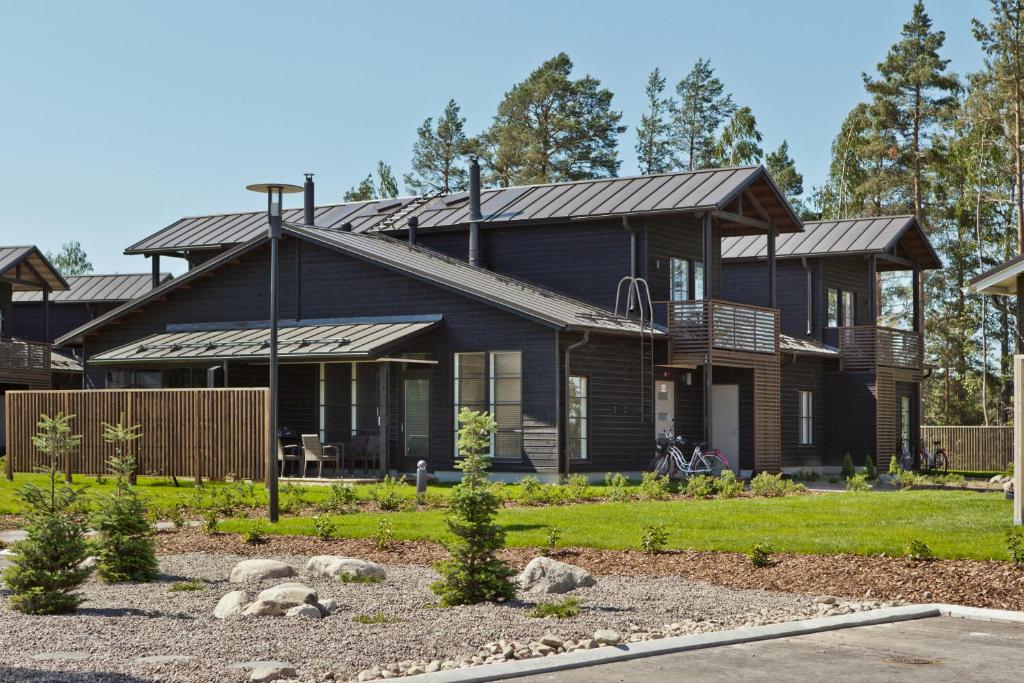 a house with a black exterior at Holiday Club Saimaa Apartments in Imatra
