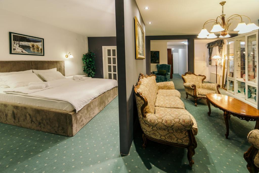 Postel nebo postele na pokoji v ubytování Garni Hotel President de Luxe