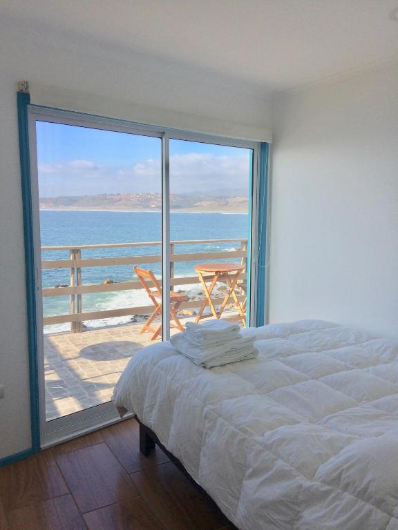 Postel nebo postele na pokoji v ubytování Bahía Luz Hostal
