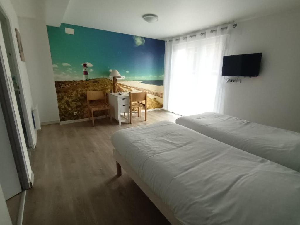 Postel nebo postele na pokoji v ubytování Escales dans les dunes
