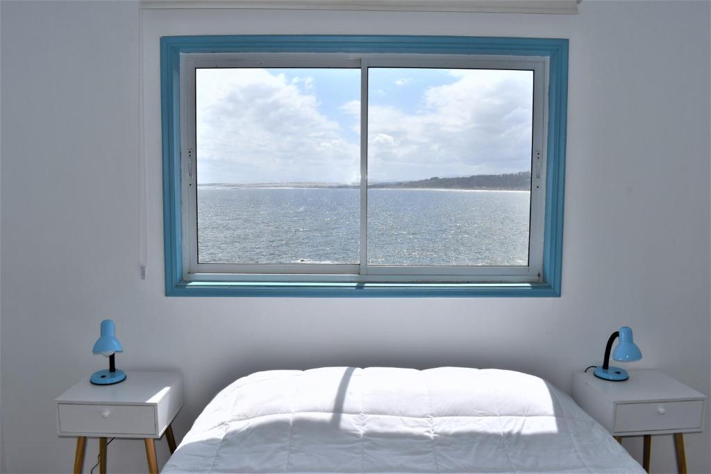 Postel nebo postele na pokoji v ubytování Bahía Luz Hostal