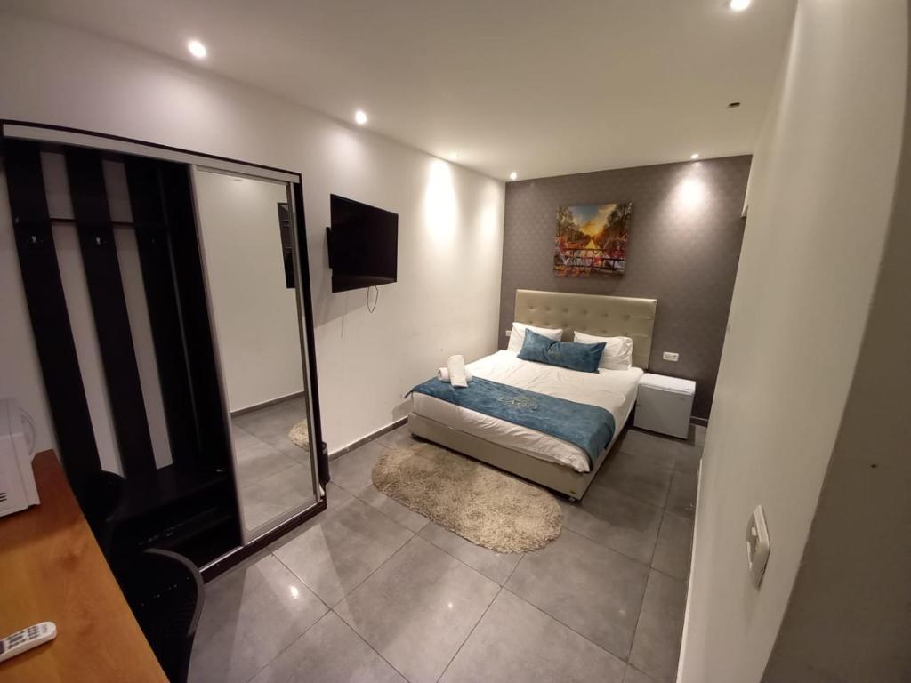 Postel nebo postele na pokoji v ubytování Elven Hotel