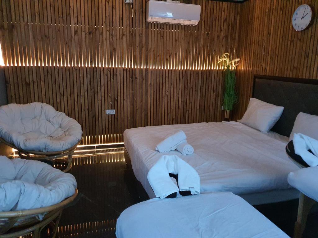 Postel nebo postele na pokoji v ubytování Elven Hotel