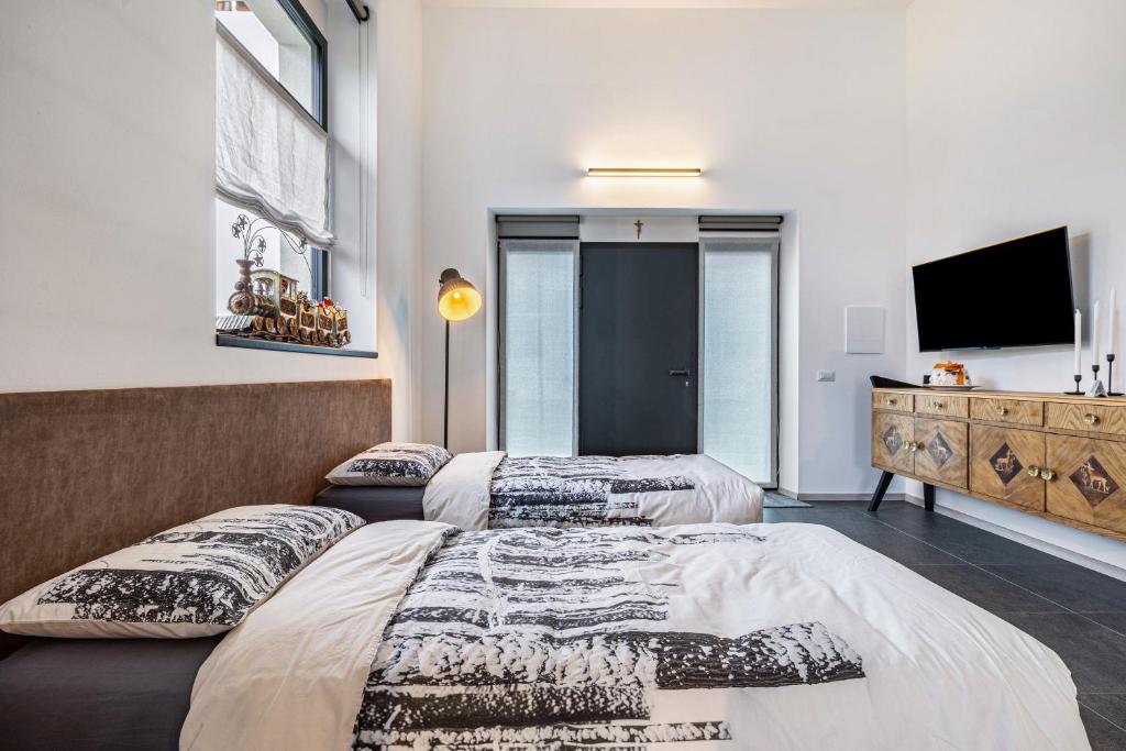 Postel nebo postele na pokoji v ubytování Loft Casa Facco