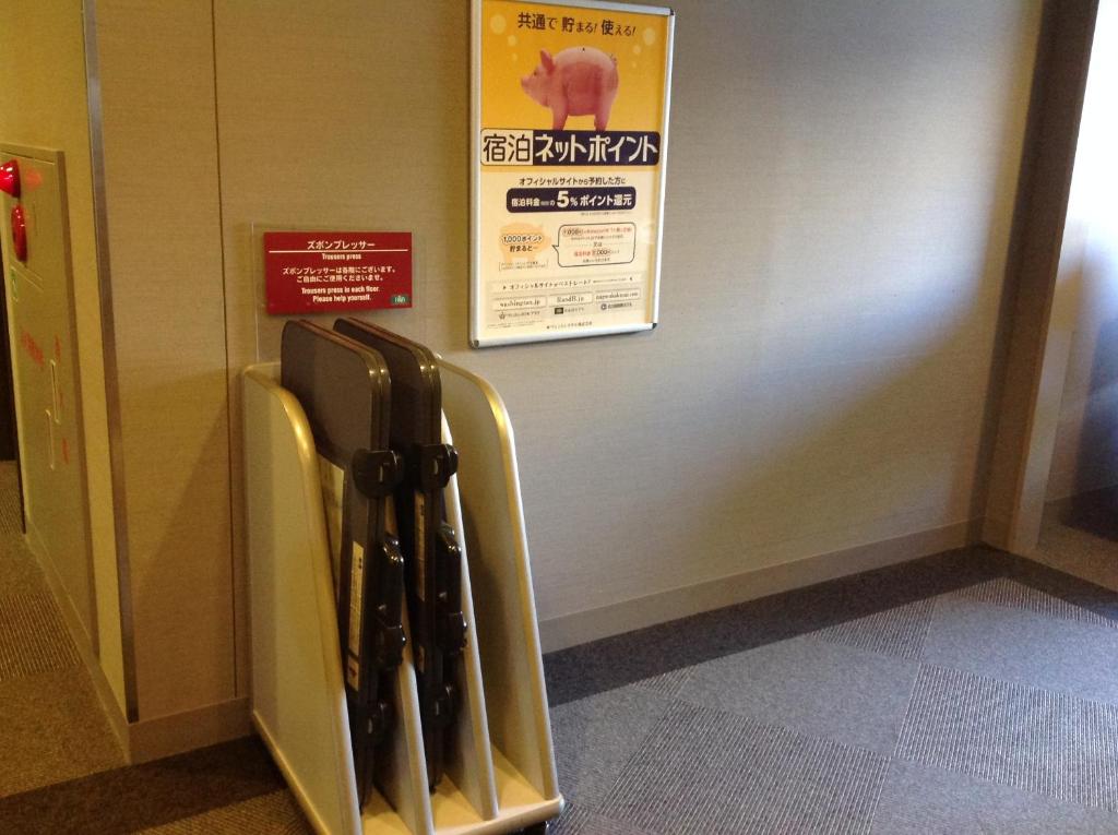 a group of baseball bats leaning against a wall at Washington R&B Hotel Hachioji in Hachioji