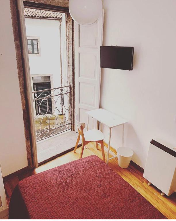 Posteľ alebo postele v izbe v ubytovaní Hostal San Pelayo