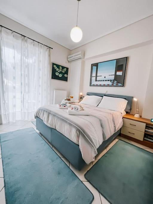 A bed or beds in a room at Mare Marina View 1