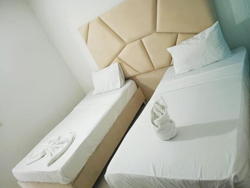 Łóżko lub łóżka w pokoju w obiekcie AW Hotel Vipassa Urban