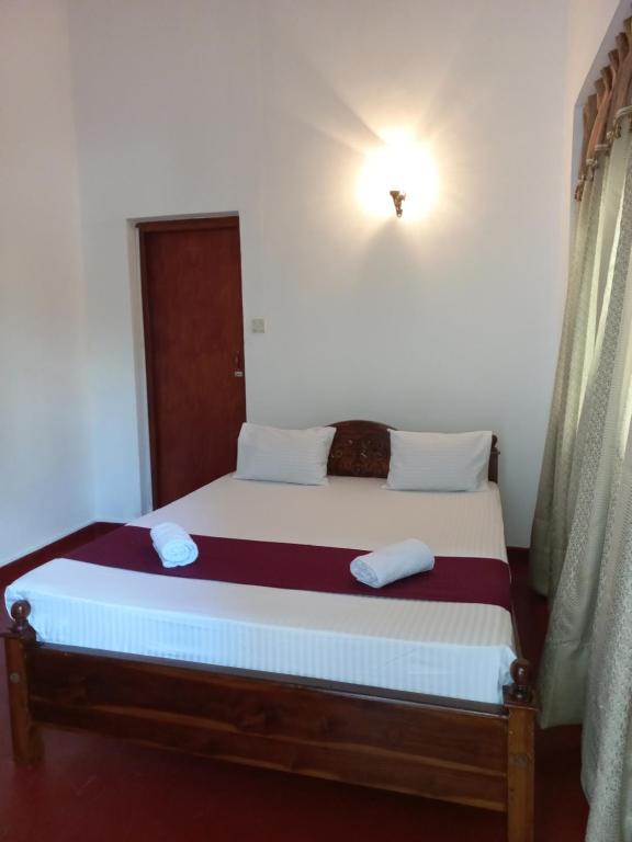 Ένα ή περισσότερα κρεβάτια σε δωμάτιο στο Lazy Bear Best Hostel in Kandy