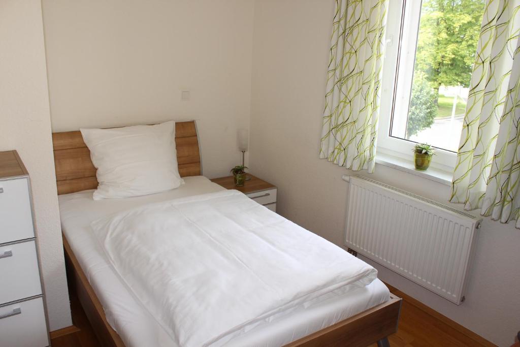 Postel nebo postele na pokoji v ubytování Boardinghouse My Maison