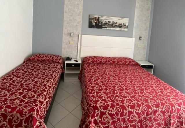 Letto o letti in una camera di Hotel Mizar
