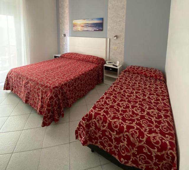 Letto o letti in una camera di Hotel Mizar