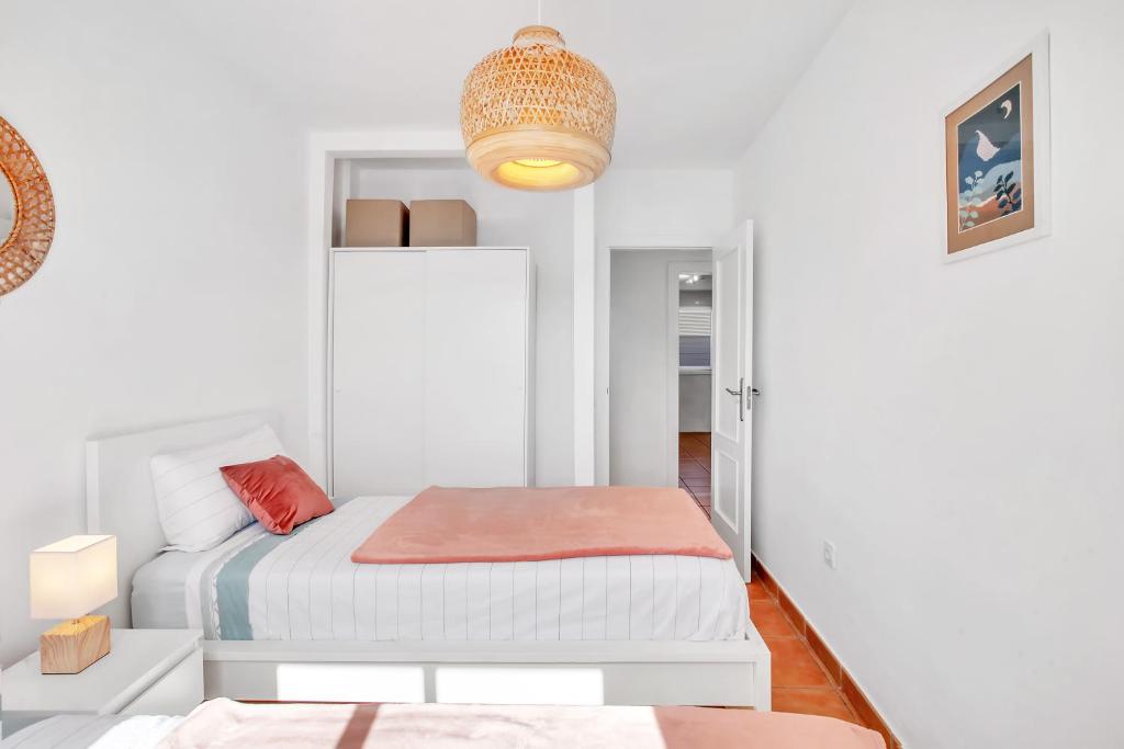 A bed or beds in a room at CASA DUNAS