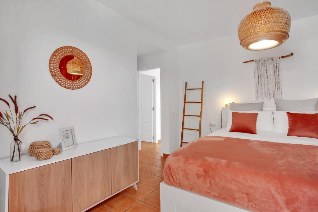 A bed or beds in a room at CASA DUNAS