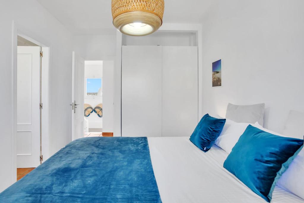 A bed or beds in a room at CASA DUNAS
