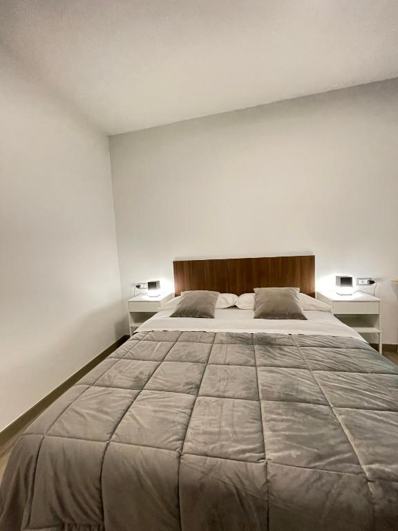 Łóżko lub łóżka w pokoju w obiekcie Smart Silver Apartment Central