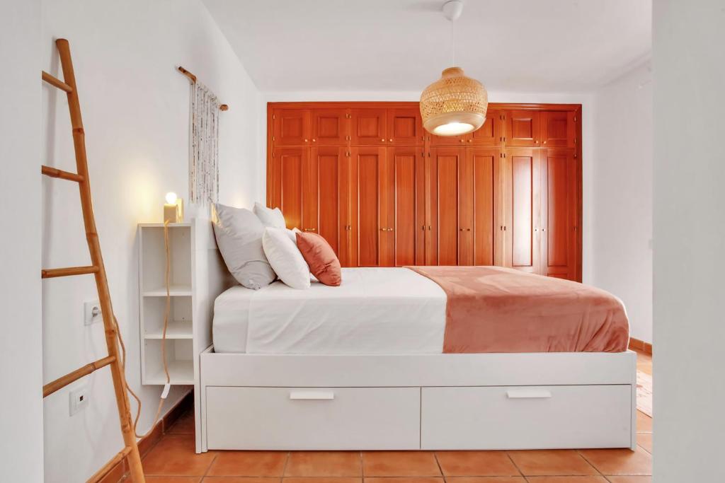 A bed or beds in a room at CASA DUNAS