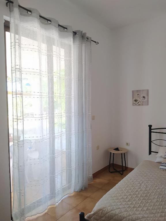A bed or beds in a room at Villa Stella Family House