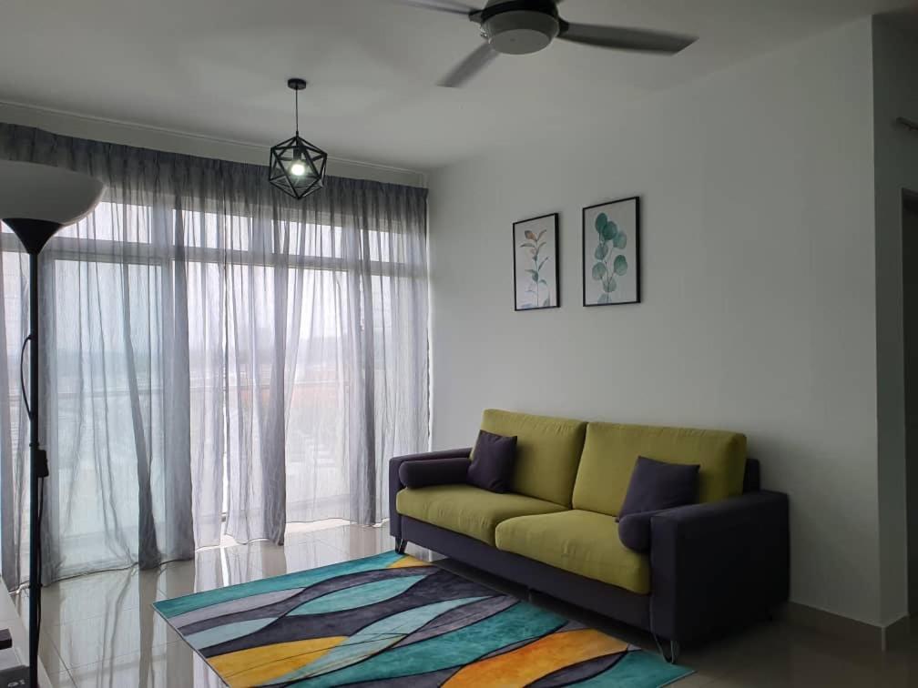 a living room with a couch and a window at SYG 4 Dwiputra Homestay Putrajaya 3 Bilik Tidur in Putrajaya