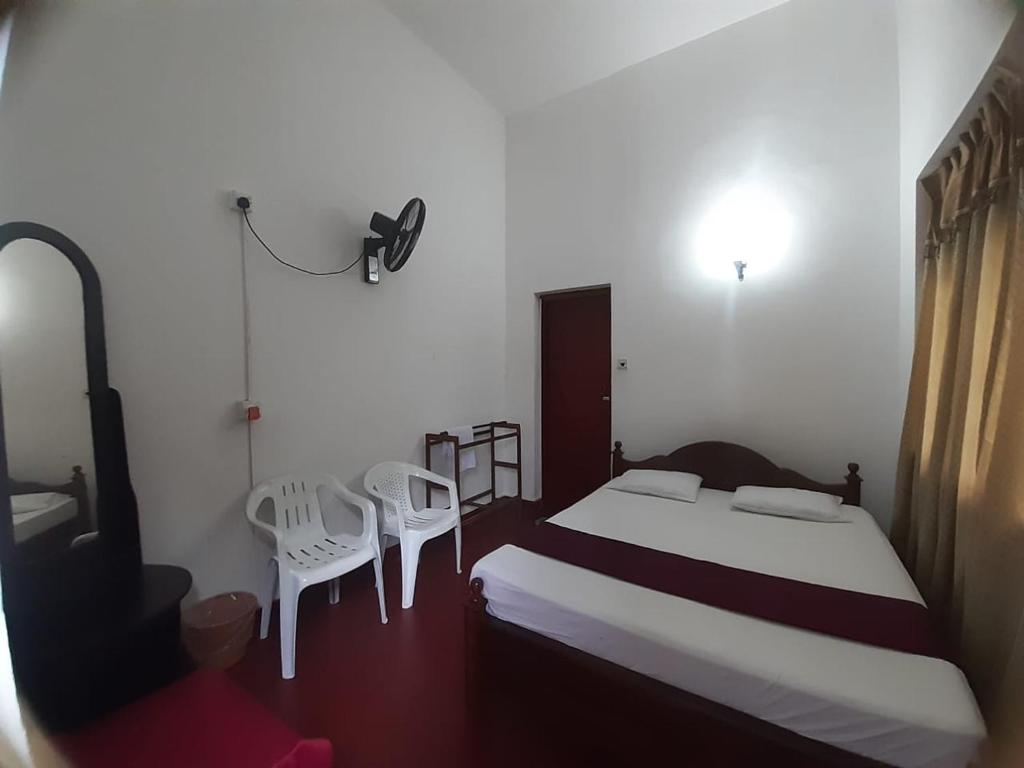 Ένα ή περισσότερα κρεβάτια σε δωμάτιο στο Lazy Bear Best Hostel in Kandy