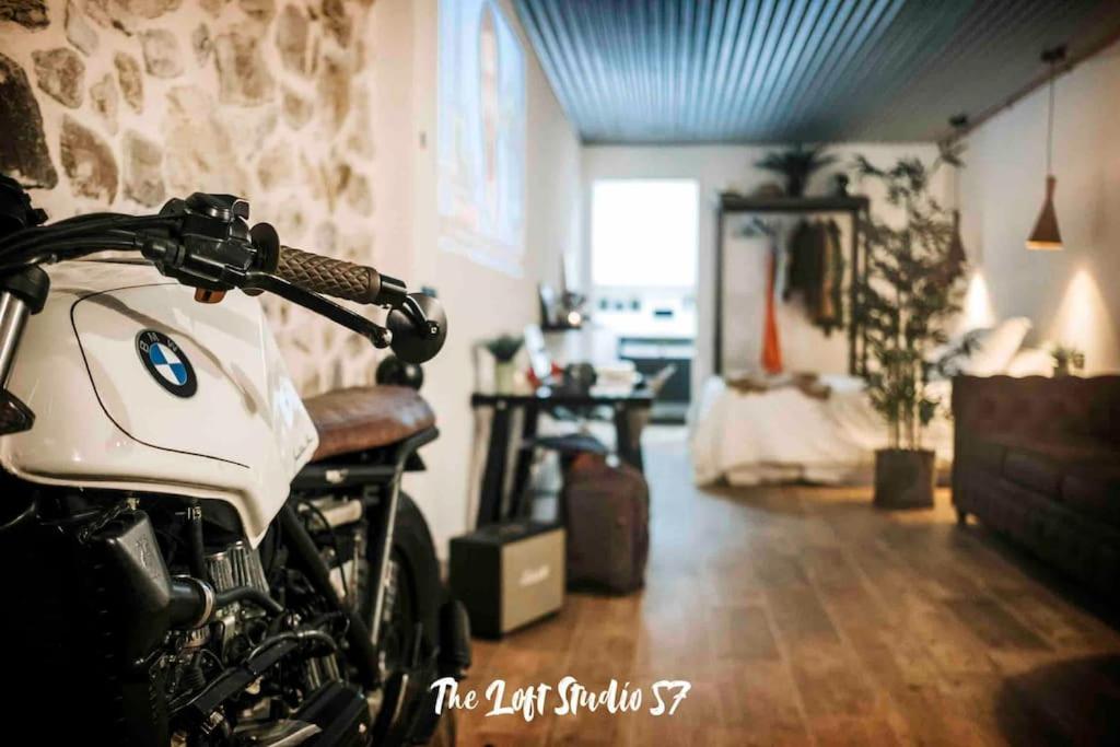 a motorcycle parked in a living room with a bride at The Loft Studio 57 - VUT.3352AS in Ribadesella