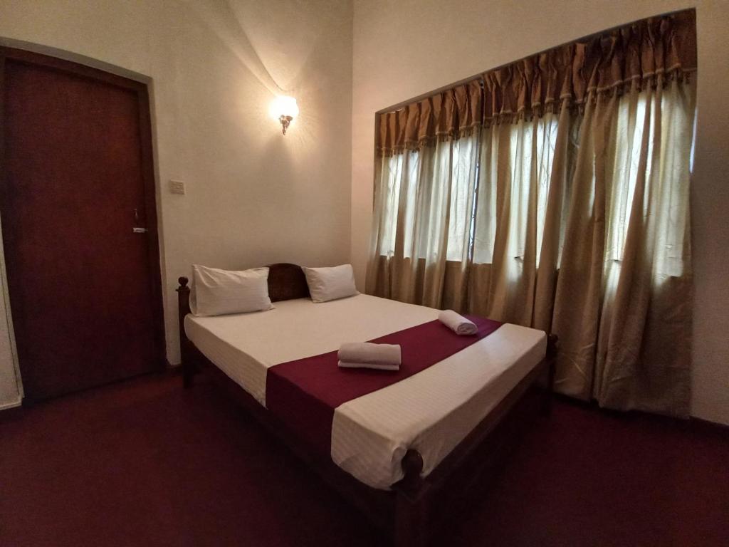 Ένα ή περισσότερα κρεβάτια σε δωμάτιο στο Lazy Bear Best Hostel in Kandy