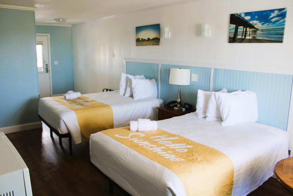 Postel nebo postele na pokoji v ubytování Blue Heron Motel