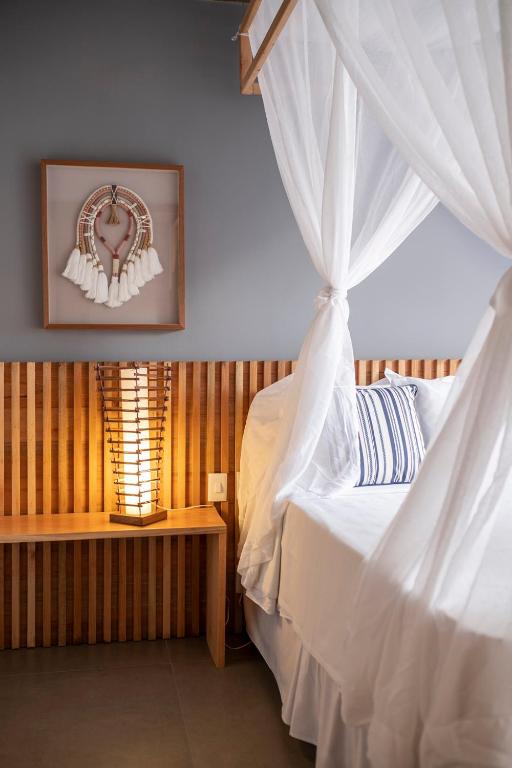 Postel nebo postele na pokoji v ubytování Santa Aldeia Hotel