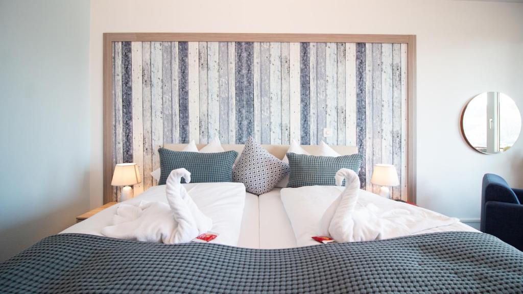 Voodi või voodid majutusasutuse Park - Hotel Inseli toas