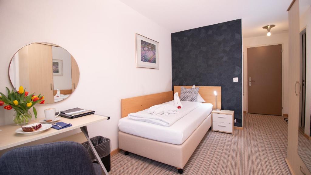 Voodi või voodid majutusasutuse Park - Hotel Inseli toas